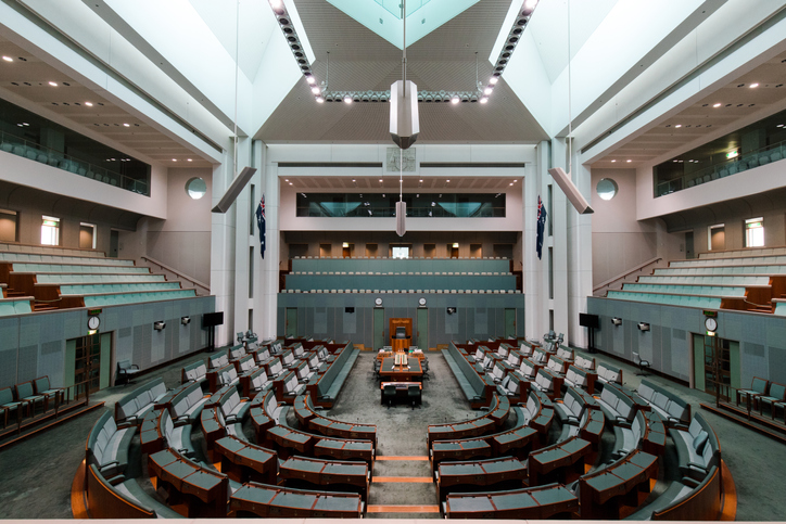 House of representatives, plenty of chairs around arranged in a circular fashion.